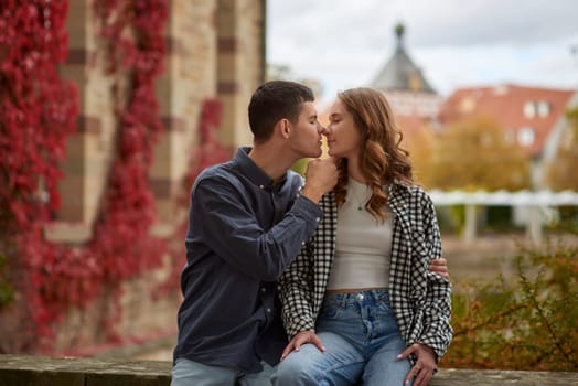 Young Cute Female Hugs Boyfriend. In Autumn Outdoor. Lovers Walking in Park. Attractive Funny Couple. Lovestory in Forest. Man and Woman. Cute Lovers in the Park. Family Concept. Happy Couple.