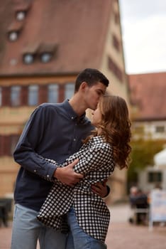 Young Cute Female Hugs Boyfriend. In Autumn Outdoor. Lovers Walking in Park. Attractive Funny Couple. Lovestory in Forest. Man and Woman. Cute Lovers in the Park. Family Concept. Happy Couple.