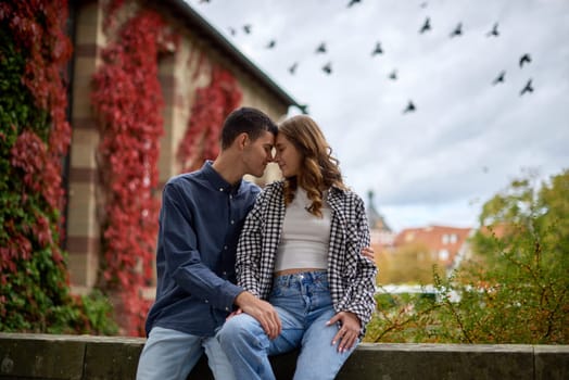 Young Cute Female Hugs Boyfriend. In Autumn Outdoor. Lovers Walking in Park. Attractive Funny Couple. Lovestory in Forest. Man and Woman. Cute Lovers in the Park. Family Concept. Happy Couple.