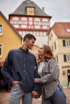 Young Cute Female Hugs Boyfriend. In Autumn Outdoor. Lovers Walking in Park. Attractive Funny Couple. Lovestory in Forest. Man and Woman. Cute Lovers in the Park. Family Concept. Happy Couple.