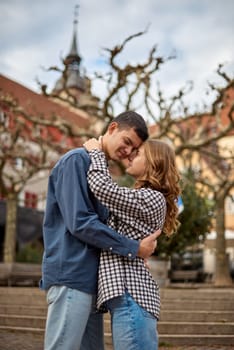 Young Cute Female Hugs Boyfriend. In Autumn Outdoor. Lovers Walking in Park. Attractive Funny Couple. Lovestory in Forest. Man and Woman. Cute Lovers in the Park. Family Concept. Happy Couple.