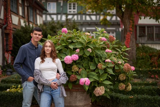 Young Cute Female Hugs Boyfriend. In Autumn Outdoor. Lovers Walking in Park. Attractive Funny Couple. Lovestory in Forest. Man and Woman. Cute Lovers in the Park. Family Concept. Happy Couple.