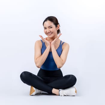 Full body asian woman in sportswear portrait, smiling and posing cheerful gesture. Workout training with attractive girl engage in her pursuit of healthy lifestyle. Isolated background Vigorous