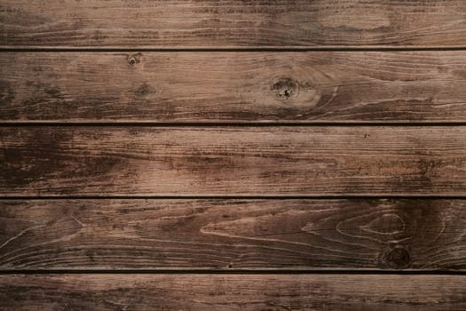 Background of brown horizontal unpainted old wooden planks. High quality photo
