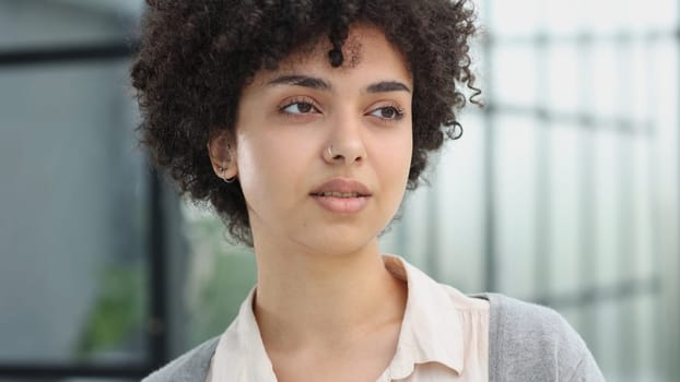 girl in the office smiles expresses success and leadership is thinking about success.