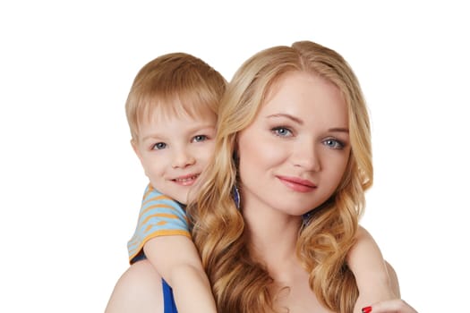 Portrait of beautiful mother and son posing at camera