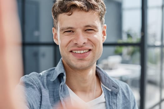 Portrait of smiling businessman standing at corporate office