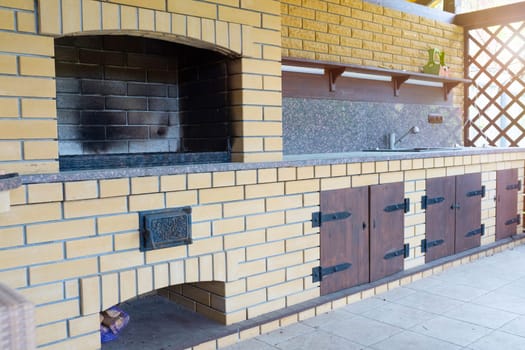 beautiful wooden terrace with fireplace on the street.