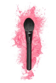 Eye brush and pink powder splash on a white background. Beauty and makeup concept.