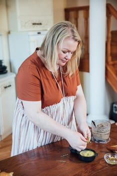 Woman cook at home in kitchen preparing food