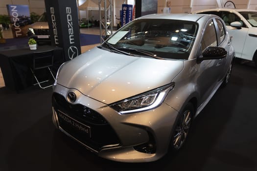 12 MAY 2023, Lisbon, Porugal, Electric car Show in International Fairy of Lisbon - A silver car is on display in a showroom