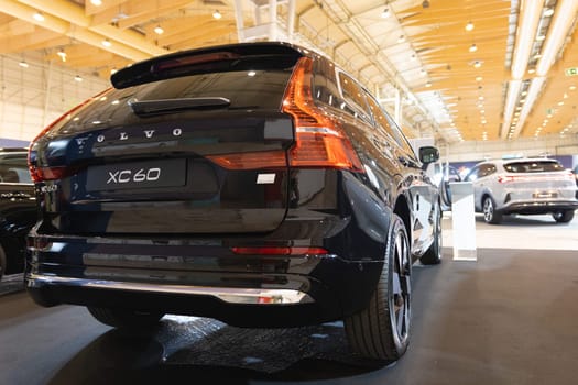 12 MAY 2023, Lisbon, Porugal, Electric car Show in International Fairy of Lisbon - A black volvo car is on display in a showroom