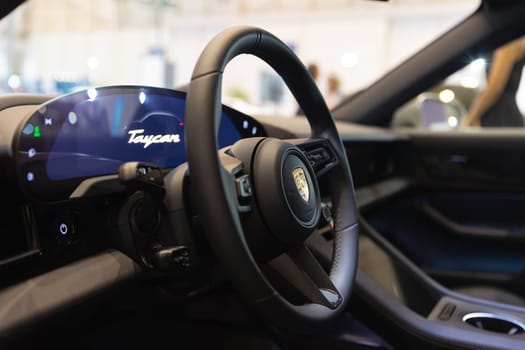 A steering wheel and dashboard of a car
