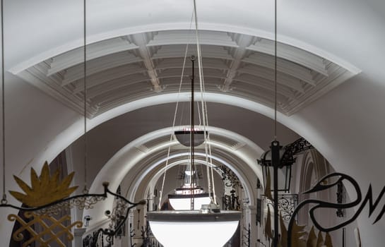London, UK - Nov 27, 2023 - Perspective of interior architecture design lamps of The Victoria and Albert Museum. Inner decor, Space for text, Selective focus.