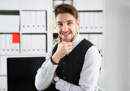 Handsome man in suit and tie stand in office looking in camera hands crossed on chest. White collar dress code modern office lifestyle graduate college study profession idea coach train concept