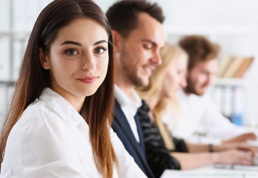 Beautiful smiling woman portrait with group of people listen carefully during seminar. Study event client conversation job customer support service case hear in court leader performance concept