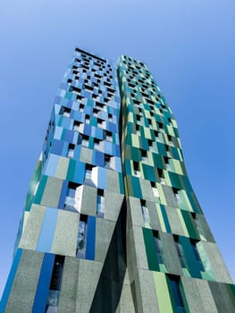 Blue and green buildings of the Forever Green Tower residential complex. Tirana, Albania. High quality photo