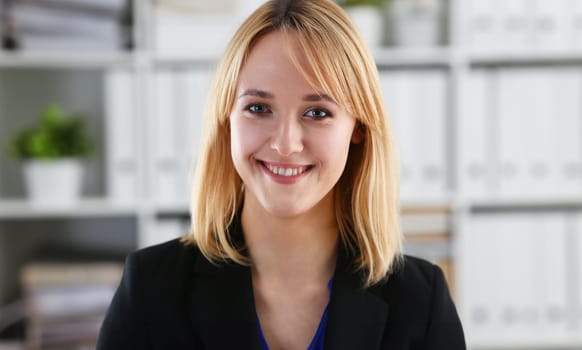 Beautiful smiling girl at workplace look in camera portrait. White collar dress code worker at workspace job offer modern office lifestyle client visit study profession boss market idea coach train