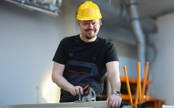 Worker using electric saw portrait. Manual job workplace DIY inspiration improvement fix shop yellow helmet hard hat joinery startup idea industrial education profession career concept