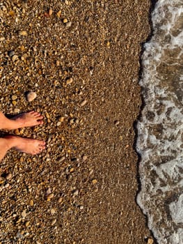 feet on the seashore beach summer vacation sea