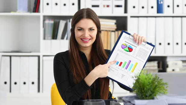 Female arm show stats graphic clipped to pad in office portrait. Stock exchange market advisor participation in negotiation study trade process white collar inspector check or explain money data