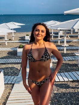 woman in swimsuit on the beach tan