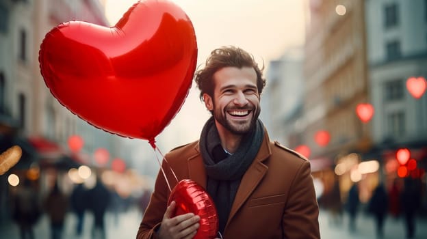 Chic, happy, smiling, handsome, luxury, sexy man walks through the streets of a European city with large red heart-shaped balloons. Valentine's day, newlyweds, engagement, holiday, birthday, wedding, anniversary, surprise, date.