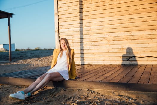 Woman under the sun sitting on floor