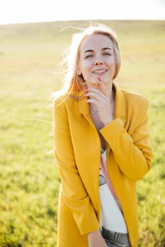 blonde in nature in the field walk journey