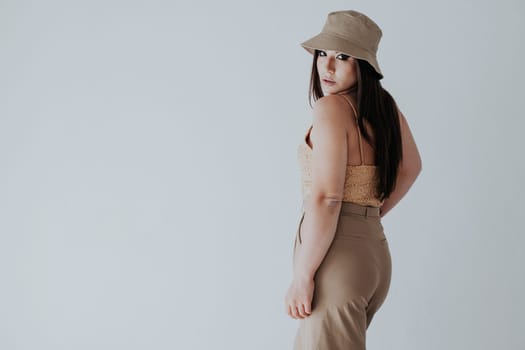 brunette in panama hat on white background