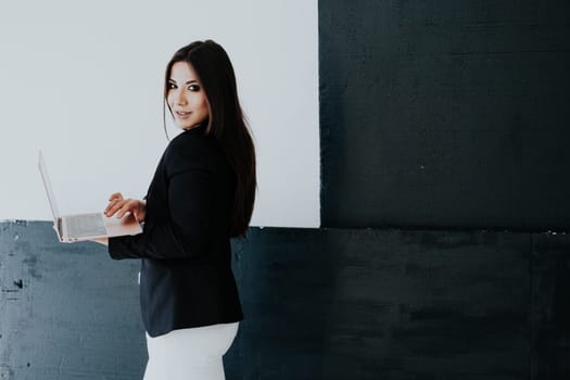 Business woman with laptop in office