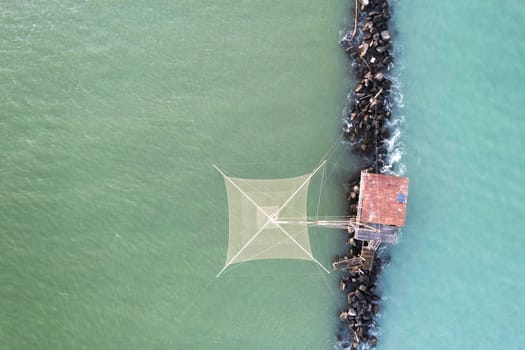 Aerial photographic documentation of the ancient fishing stations at the mouth of the Arno river Tuscany Italy 