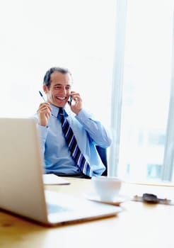 Businessman, happy and phone call for discussion in modern office for consultation, communication or planning. Corporate, male manager or smile with technology for online, conversation or connection.