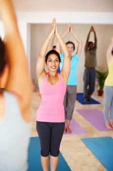 Fitness, yoga and people in class stretching, exercise and workout on mat for wellness. Pilates, health club and portrait of instructor with men and women for flexibility, balance and healthy body.