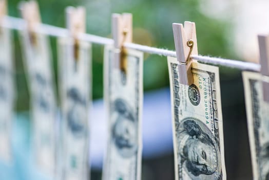 Money Laundering. Money Laundering US dollars hung out to dry. 100 dollar bills hanging on clotheslines
