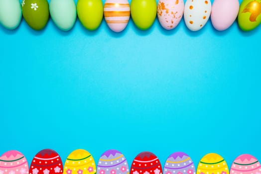 Easter Eggs. Colorful Easter eggs on blue background with copy space.