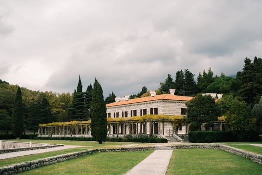 Villa Milocer surrounded by a green garden. Montenegro. High quality photo