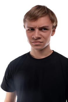 Confused teenager guy with blond hair furrowed his eyebrows.