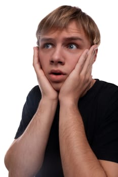 Headshot portrait of an unhappy blond Caucasian guy in a black T-shirt.