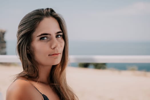 Happy woman portrait in cafe. Boho chic fashion style. Outdoor photo of young happy woman with long hair, sunny weather outdoors sitting in modern cafe