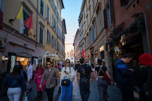 Rome, Italy: 2023 November 14: Tourists walking through the historic center of the city of Rome in Italy in 2023.