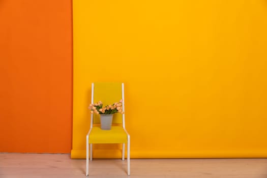 yellow chair in orange wall interior