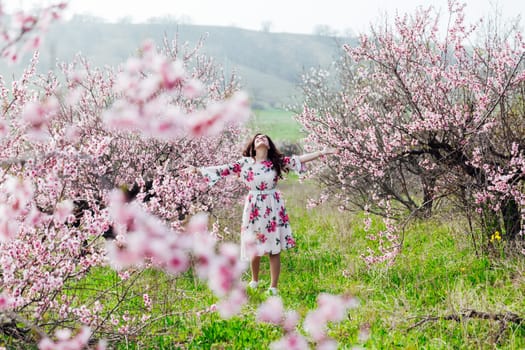 beautiful woman in peach orchards spring nature travel walk