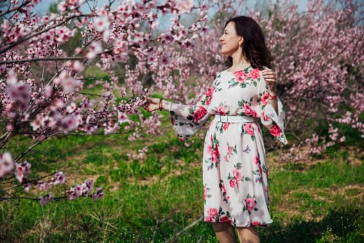 beautiful woman in peach orchards spring nature travel walk