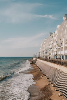 coastal area with apartment buildings of residential areas, modern hotel and restaurant complex on water and sandy beaches