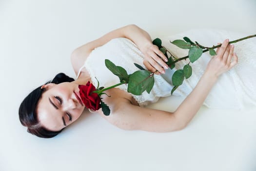 brunette woman with red rose flower