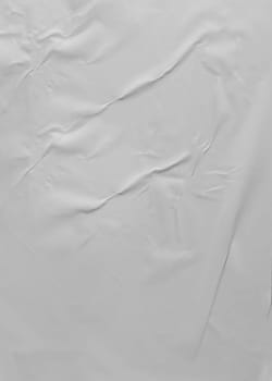 Background texture of crumpled gray vertical paper