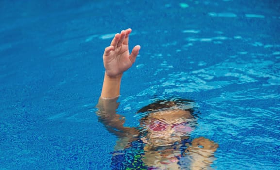 The child drowns in the water. Selective focus. Kid.