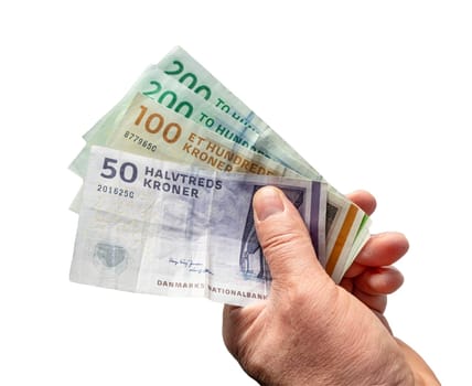 some Danish krone banknotes in a male hand with a transparent background