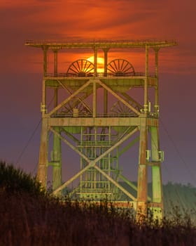 Headframe of old cold mine against sky, industrial heritage of Ruhr Metropolis, Dortmund, Germany